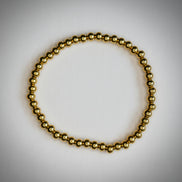 Pulsera Cuentas Doradas